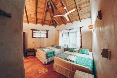 a bedroom with two beds in a room at Altos de Caño Hondo in Los Guineos Perdidos