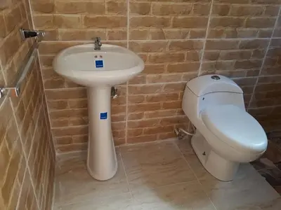 a bathroom with a sink and a toilet at Apartahotel Next Nivel - Queen Room with Fan in Punta Cana