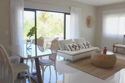 a living room with a couch and a table at Amar'e Aparthotel & Spa in Las Terrenas