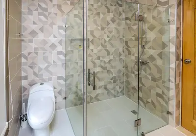 a bathroom with a shower with a toilet at Amar'e Aparthotel & Spa in Las Terrenas