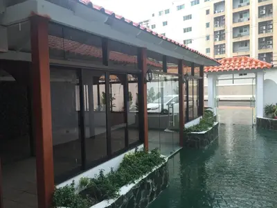 a building with water in the middle of a street at Hotel Santander SD in Santo Domingo