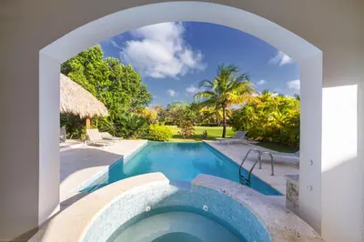 an archway leading to a swimming pool in a villa at Best Private Cocotal Villas in Punta Cana in Punta Cana