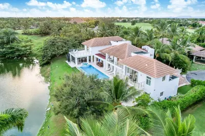 an aerial view of a white house with a swimming pool at Best Private Cocotal Villas in Punta Cana in Punta Cana