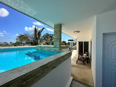 a view of a swimming pool from a house at Apartamento Carey in Cabrera