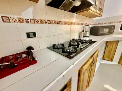 a kitchen with a stove top oven in a kitchen at Apartment Travis l in La Viva