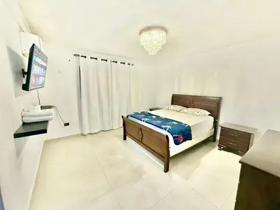 a bedroom with a bed and a flat screen tv at Apartment Travis l in La Viva
