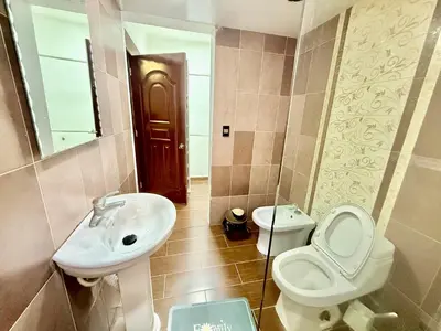 a bathroom with a sink and a toilet and a mirror at Apartment Travis l in La Viva