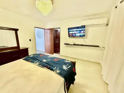 a bedroom with a bed and a flat screen tv at Apartment Travis l in La Viva