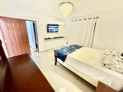 a bedroom with a bed and a flat screen tv at Apartment Travis l in La Viva