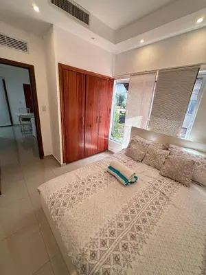 a bedroom with a large bed with a pillow on it at Paradise Suite Cadaqués in Bayahibe
