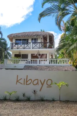a house with a sign in front of it at Kibayo Lagoon Villa in Cabarete