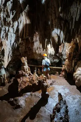 a man standing in a cave with a beam at Kibayo Lagoon Villa in Cabarete