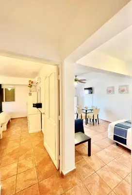 a room with a bed and a dining room at Villa Iguana in Bayahibe