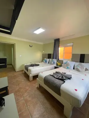 a bedroom with two beds in a room at Villa Iguana in Bayahibe