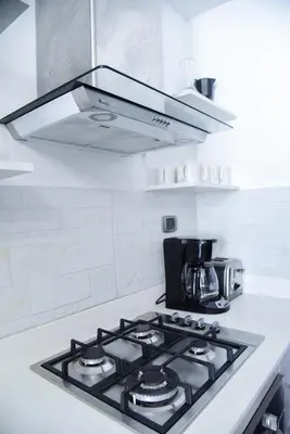 a stove top oven in a white kitchen at S1404 Vista espectacular Downtown Santo Domingo in Santo Domingo