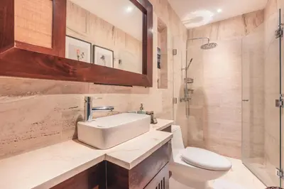a bathroom with a sink and a toilet and a shower at Newly Added 1BR El Portillo Luxury in Portillo