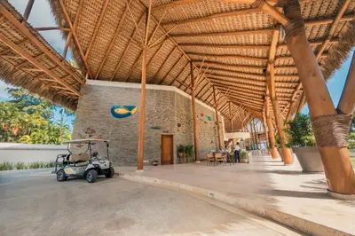 a pavilion with a golf cart parked inside of it at Newly Added 1BR El Portillo Luxury in Portillo