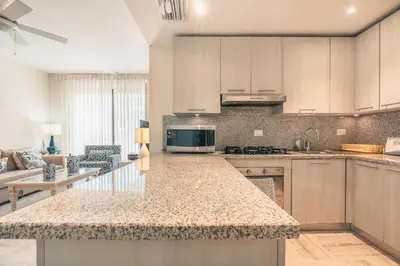 a kitchen with a large island in a room at Newly Added 1BR El Portillo Luxury in Portillo