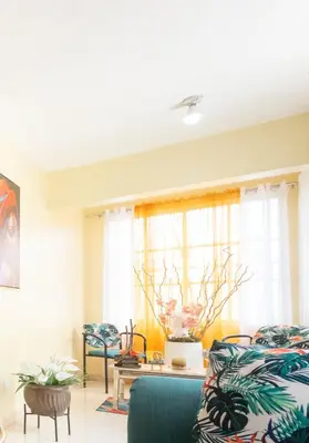a living room with a couch and a table at Acogedor Espacio en Santo Domingo Este. in Mandinga