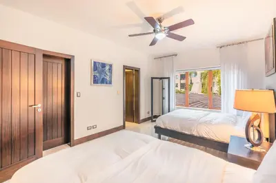 a bedroom with a bed and a ceiling fan at Townhouse with ocean view Puerto Bahia in Los Grini