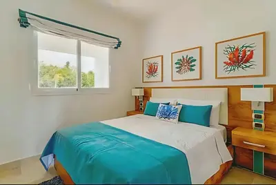 a bedroom with a bed and a window at Cana Rock 108 Acceso Directo Piscina Punta Cana in Punta Cana