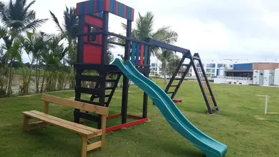 a playground equipment with a slide and a slide at Apartamento 120 Jardin Privado Cana Rock in Punta Cana