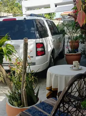 a white van parked in a parking lot with a table at Villa Julirous Rd-spa and ApartHotel, Camp for vacationers, 2 bedrooms in Boca Chica