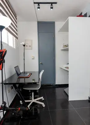 an office with a desk with a laptop on it at Villa Dylan Samana, Luxury 3Br with pool in Santa Bárbara de Samaná