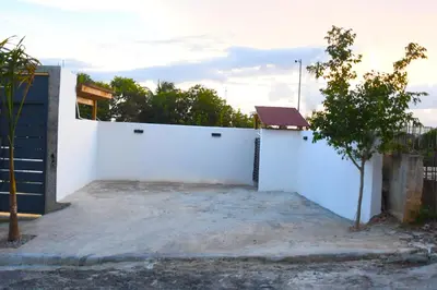 a white fence in front of a house at Villa Dylan Samana, Luxury 3Br with pool in Santa Bárbara de Samaná