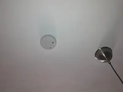 a light on a ceiling with a lamp on it at Modern, Welcoming Studio, Ocean View in Juan Dolio in Juan Dolio