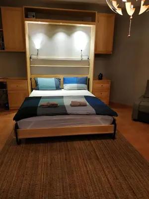 a bedroom with a large bed with a large headboard at Modern, Welcoming Studio, Ocean View in Juan Dolio in Juan Dolio