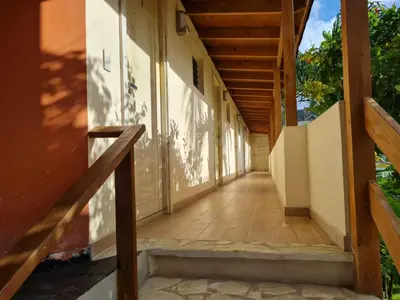 an empty hallway of a house with stairs at guest house MY WAY in Las Terrenas