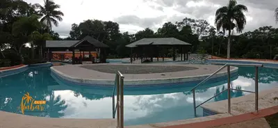a swimming pool with a gazebo and a swimming pool at Villas Club Ámbar in Cacique