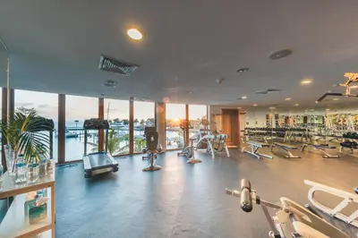 a gym with a lot of treadmills and machines at 3BR Beachfront townhouse at Puerto Bahia in Santa Bárbara de Samaná