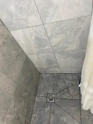 a tile ceiling with a drain in the floor at Casa De Matias in Las Terrenas