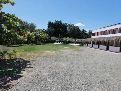 a view of the courtyard of a building at Piscalonga Hotel Restaurant Cozy Family Operated in San Lorenzo de Guayubín