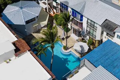 an overhead view of a swimming pool next to a building at One Bedroom Apartment in Sosua , Great for Remote Workers Fast Wifi in Sosúa