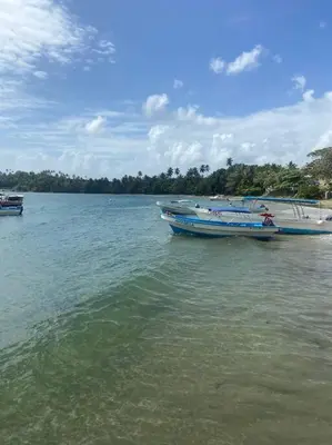 a group of boats sitting in the water at One Bedroom Apartment in Sosua , Great for Remote Workers Fast Wifi in Sosúa