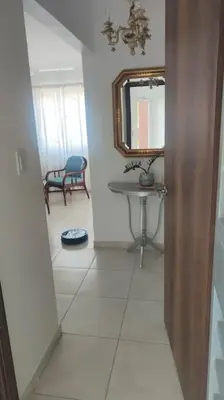 a hallway with a sink and a mirror in a room at Minerva in La Ureña