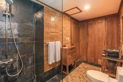 a bathroom with a shower and a toilet at Glamorous w Jacuzzi Balcones del Atlntico in Portillo