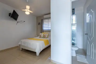a bedroom with a bed and a sink and a toilet at EDMA APARTAHOTEL in Santa Bárbara de Samaná