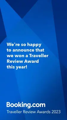 a blue sign that says were so happy to announce that we won a traveler at Torre Rialto in Santiago de los Caballeros
