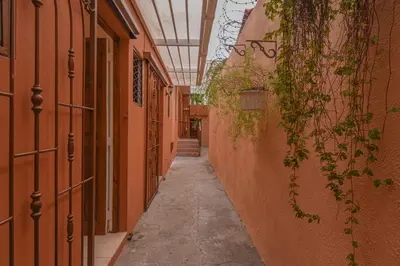 an empty hallway with orange walls and a ceiling at PH 19 Guesthouse Hotel in Gazcue in Santo Domingo
