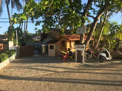 a group of motorcycles parked in front of a house at La Cortesana Cozy Apt Steps to the Beach in Las Terrenas