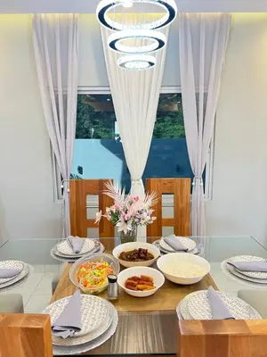 a dining room table with plates and bowls of food at 5 Star Villa minutes from Airport and Beaches in Sosúa
