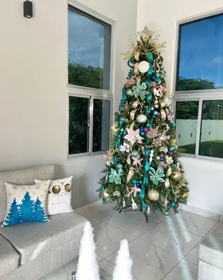 a christmas tree in a living room with a couch at 5 Star Villa minutes from Airport and Beaches in Sosúa