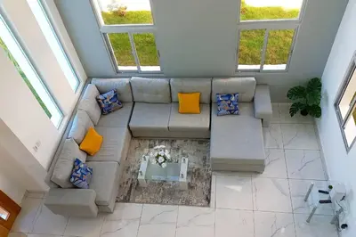 an overhead view of a living room with a couch at 5 Star Villa minutes from Airport and Beaches in Sosúa