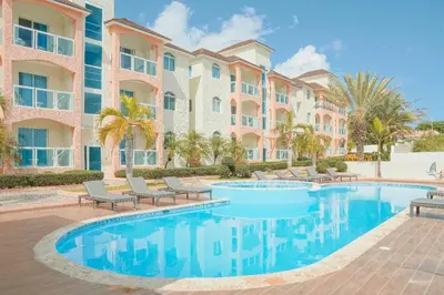 a swimming pool in front of a building at Ria Hotel in San Felipe de Puerto Plata