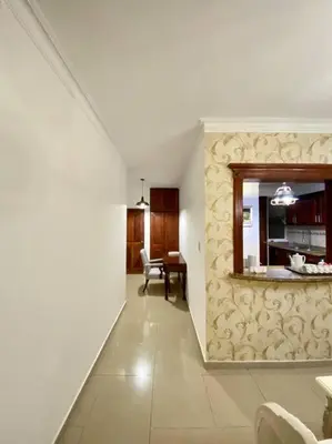 a hallway with a living room and a dining room at Beautiful Penthouse in La Vega, RD in Concepción de La Vega