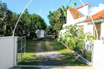 a gate to the yard of a house at El Conde del Macao in Salado